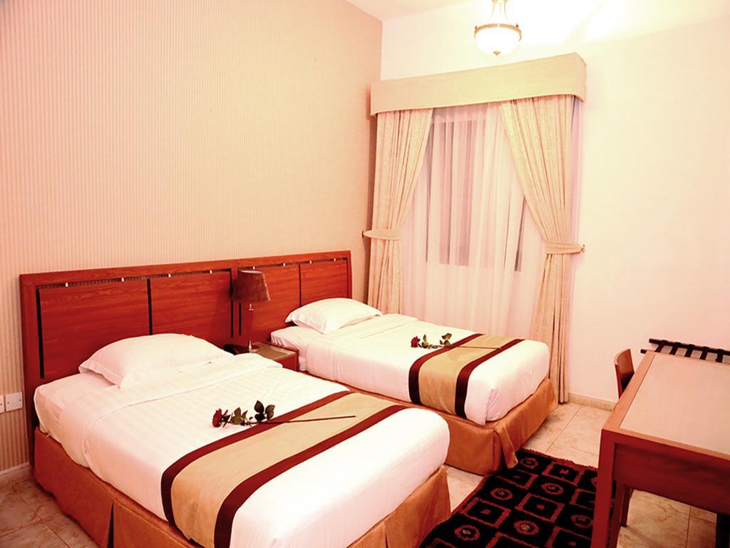 Arcadia Hotel Suites Charjah Chambre photo
