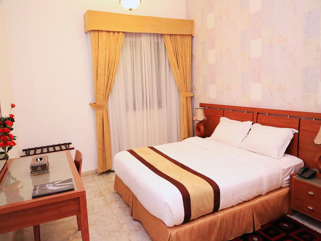 Arcadia Hotel Suites Charjah Chambre photo
